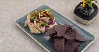 Red Cliff Lake trout with white bean spread and blue corn tostada © Owamni